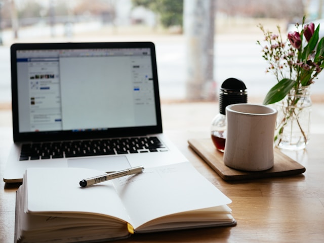 Desk with laptop and accounting materials
